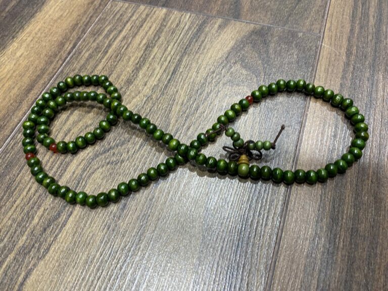 Image of a string of 108 green mala beads