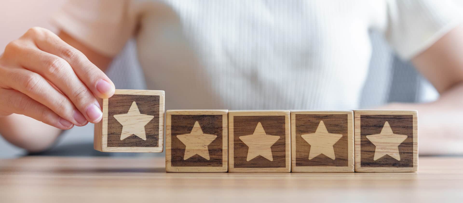hand holding Star block. Customer choose rating for user reviews. Quality, Service rating, ranking, customer review, satisfaction, evaluation and feedback concept